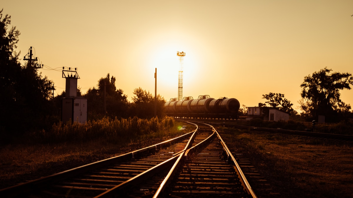 Railroad tracks under a sunset
