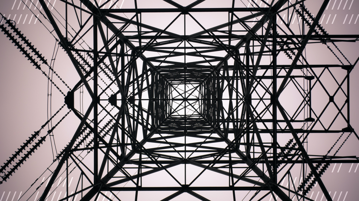 Bottom-up view of a square metallic construction, such as a radio tower.