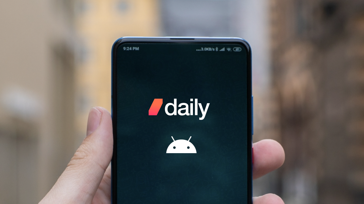 A hand holding an Android phone with Daily and Android logos